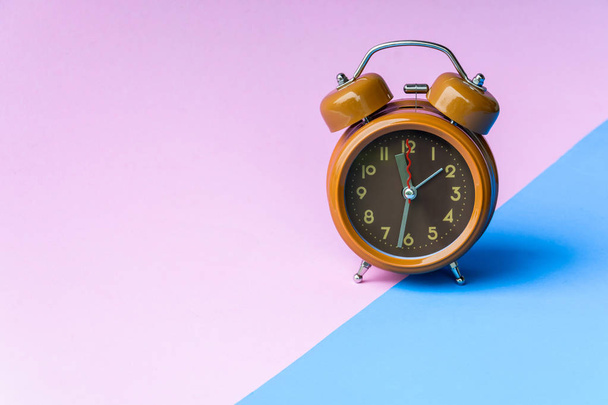brown clock and pink background - Photo, image