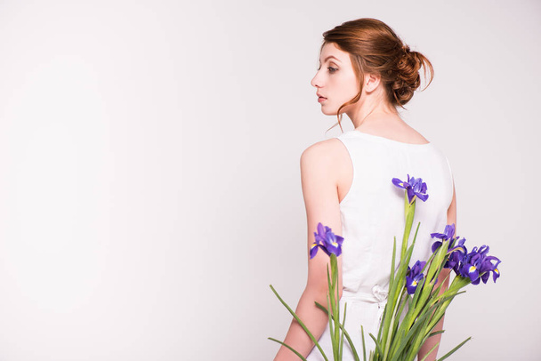 beautiful woman with iris flowers - Φωτογραφία, εικόνα