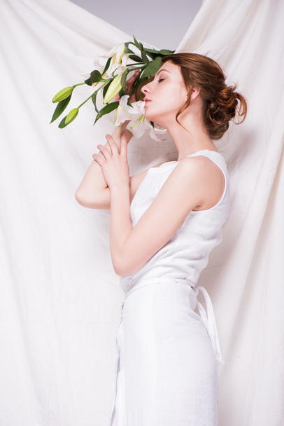 beautiful woman with lily flowers - Photo, Image