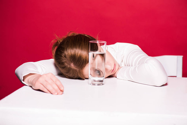 young woman with glass of water - 写真・画像