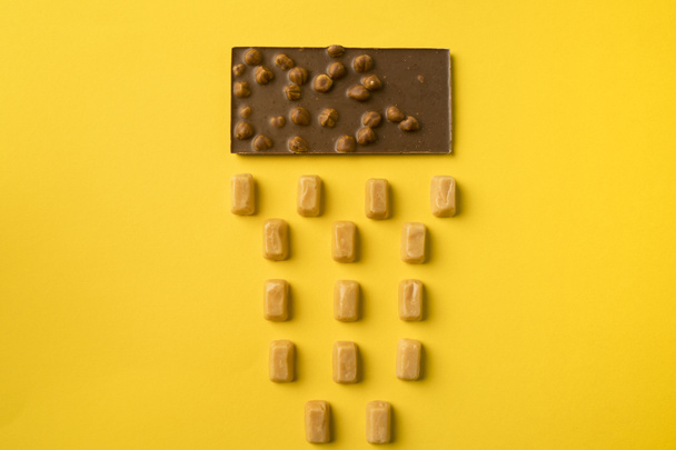 Chocolate bar and iris milk candies - Foto, Imagen