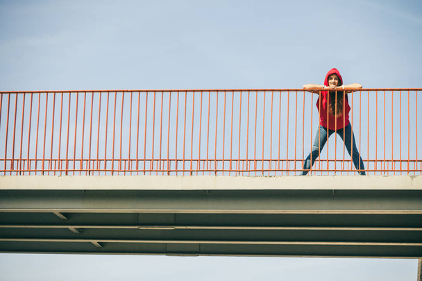 Girl on bridge in city. - Photo, Image