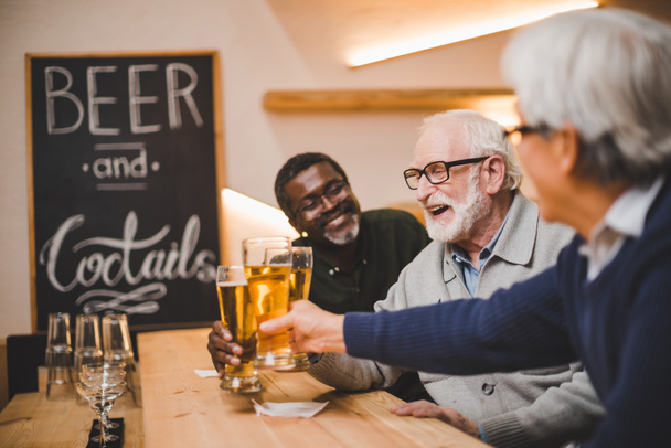 senior friends drinking beer together - Photo, Image