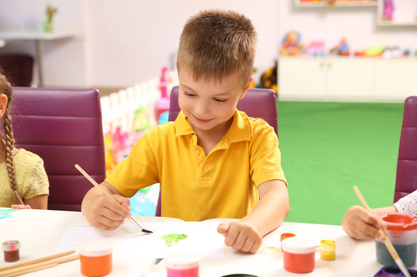 Little boy at painting lesson   - Foto, imagen
