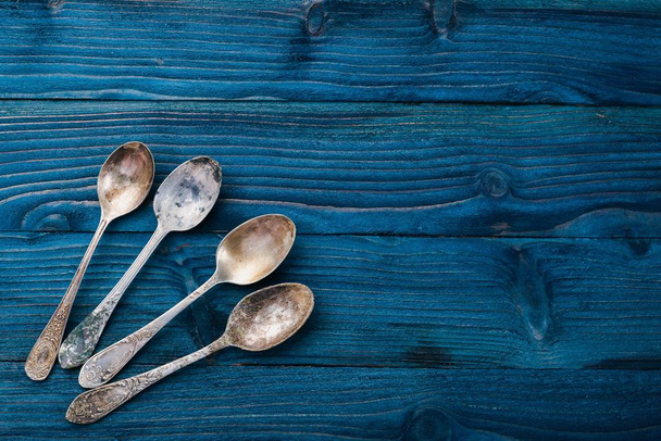 Old cutlery. On a wooden background. Top view. Free space for text. - Foto, Imagem