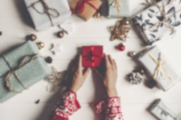hands holding red gift box - 写真・画像