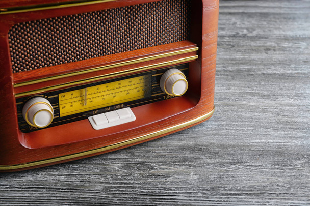 Retro radio on table - Фото, изображение