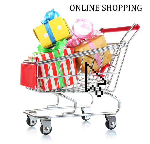 Gift boxes in shopping cart on white background. Internet shopping concept - Фото, зображення