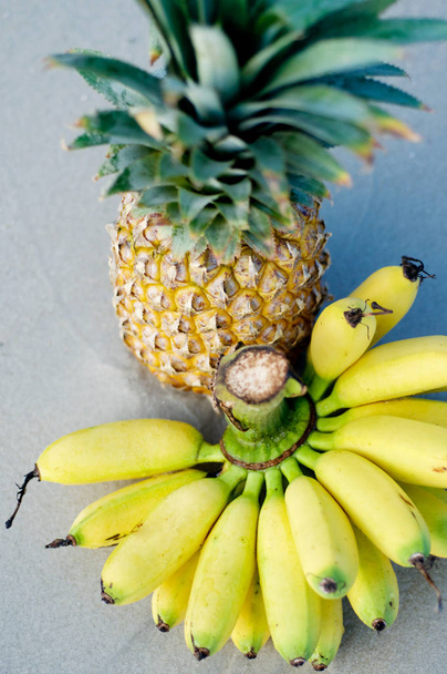 fresh pineapple and banana fruits on a white background - Fotografie, Obrázek