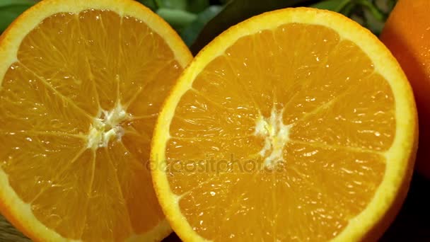 Orange cut in half. Camera moves from left to right. - Footage, Video