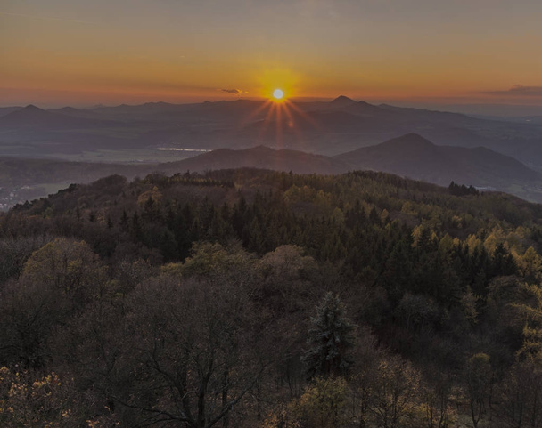 Sunset evening on Varhost hill in Ceske Stredohori mountains - Fotó, kép
