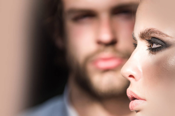 Woman face profile with blurred man on background - Zdjęcie, obraz