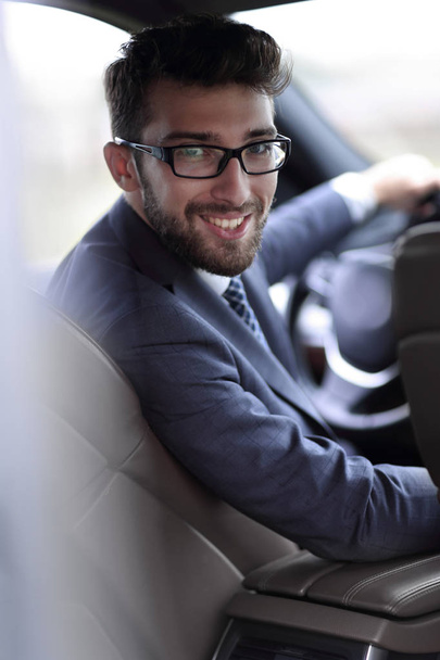 man in formalwear sitting in car - Photo, image
