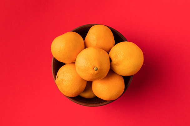 tangerines in bowl - Фото, изображение