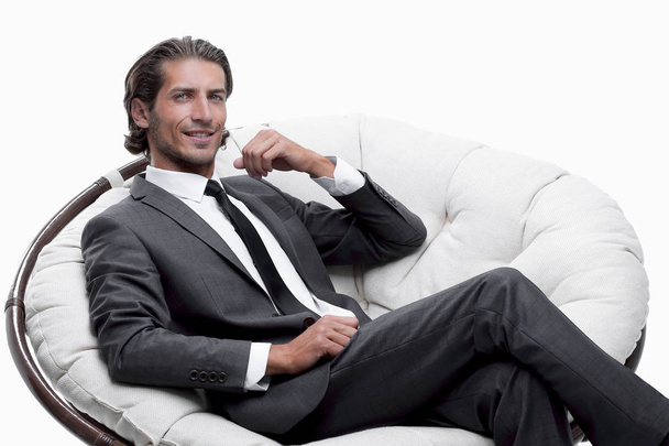 businessman sitting in a comfortable big chair - Foto, imagen