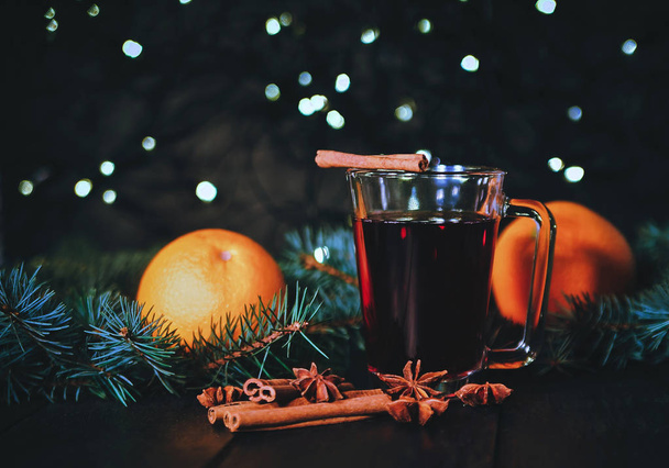 Stylized photo of a mulled wine on a christmas background  - Foto, Imagem