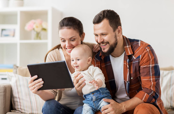mother, father and baby with tablet pc at home - Fotografie, Obrázek