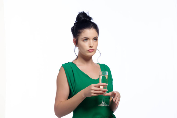 Young woman holding a champagne flute  - Foto, Bild