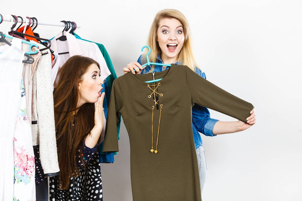 Women clothes shopping choosing dress - Foto, Imagem