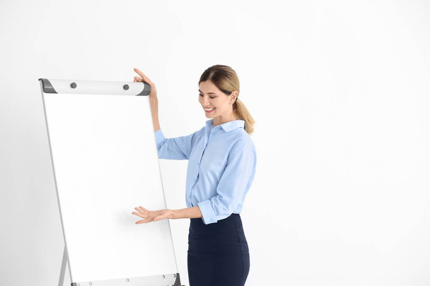 Business trainer giving presentation on whiteboard - Фото, изображение