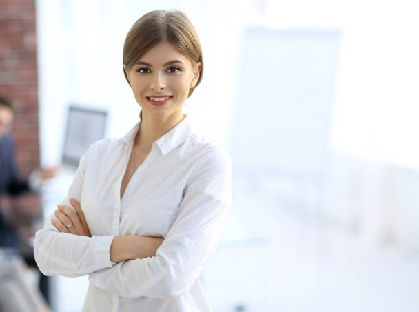 portrait of young business woman on the background of the office - Fotó, kép