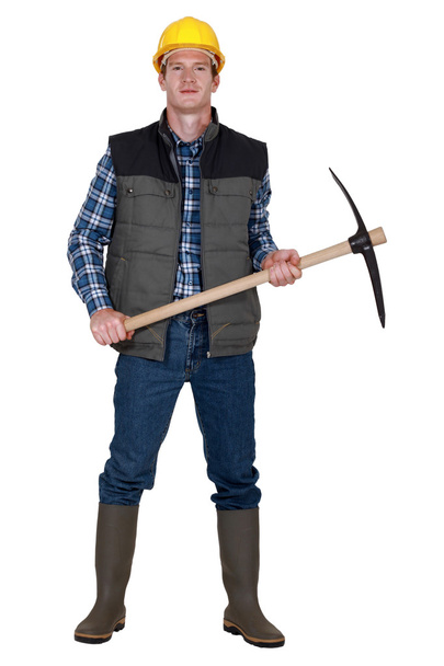 Man stood with pick ax - Фото, зображення