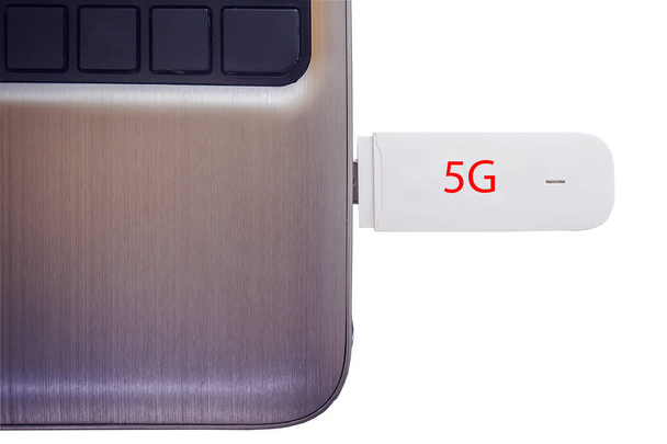 5G modem connected in modern notebook closeup isolated on white background. - Foto, immagini