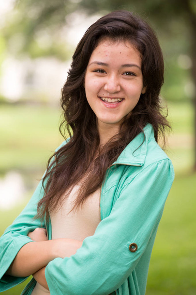 Young teen girl smiling outside. - Photo, Image