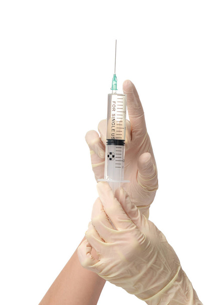 Doctor hand with medical syringe in hand ready for injection - Foto, imagen