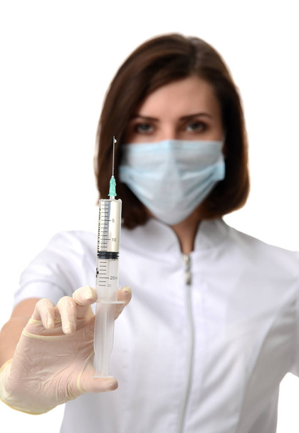 Doctor nurse with syringe needle ready  for flu injection vaccination concept  - Photo, image