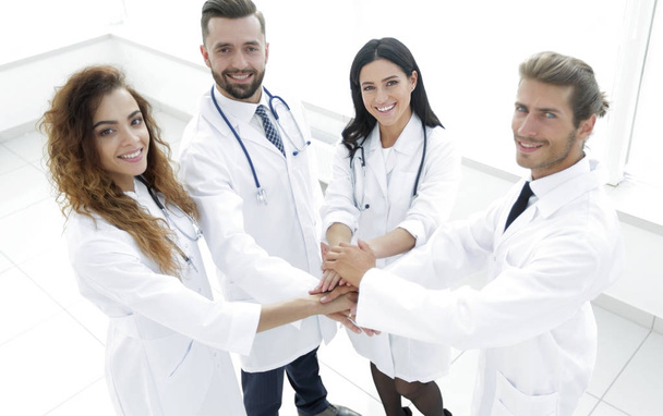 friendly team of doctors shows their success - Photo, image
