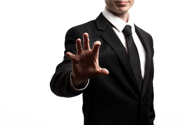 Geschäftsmann zeigt mit dem Finger auf weißen Hintergrund - Foto, Bild