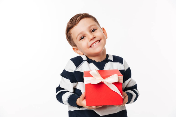 Portrait of a lovely cute little kid holding present box - Photo, image
