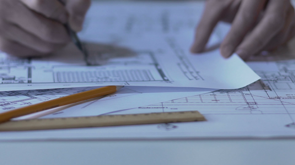 Architect checking layouts of buildings, working on design of new housing estate - Footage, Video