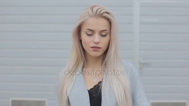 Portrait of Beautiful caucasian blonde woman laughing in the end. slow motion - Footage, Video