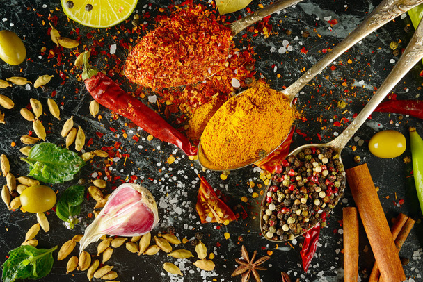 Variety of spices and herb on kitchen table. - 写真・画像