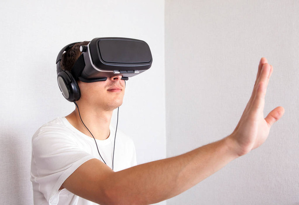Young Man in VR Glasses - Photo, Image