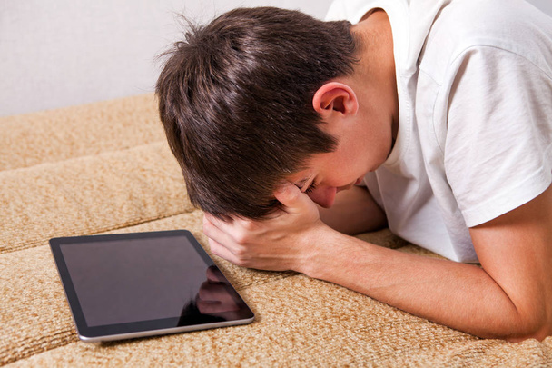 Sad Young Man with Tablet - Zdjęcie, obraz