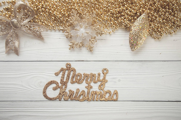 christmas background with holiday ornaments on white wood - Foto, imagen