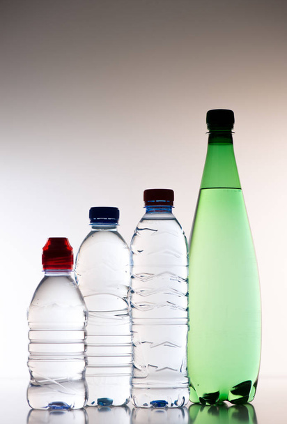 Plastic bottles of water isolated on a white background - Zdjęcie, obraz