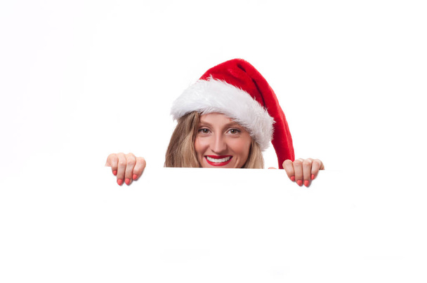 Christmas. Beautiful woman wear santa hat - Foto, Imagem