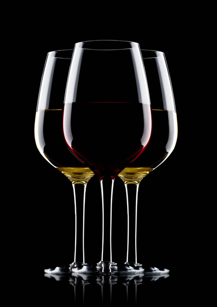 Glasses of red and white wine on black - Foto, Imagem
