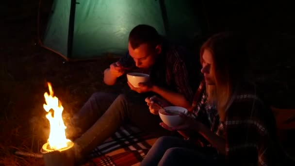 Young couple near campfire - Footage, Video