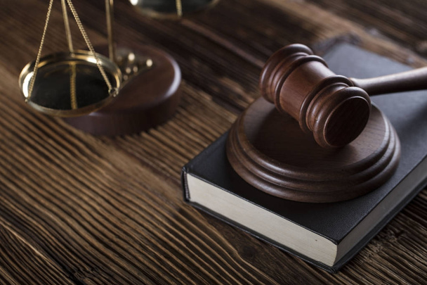Scale of justice, gavel and book on a wooden background. - 写真・画像