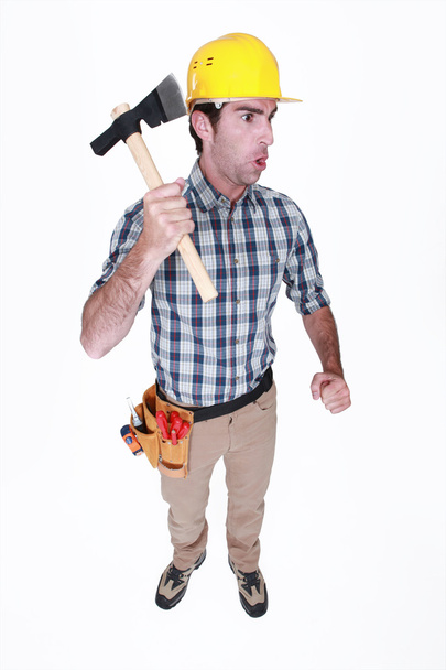 Angry worker holding axe - Zdjęcie, obraz