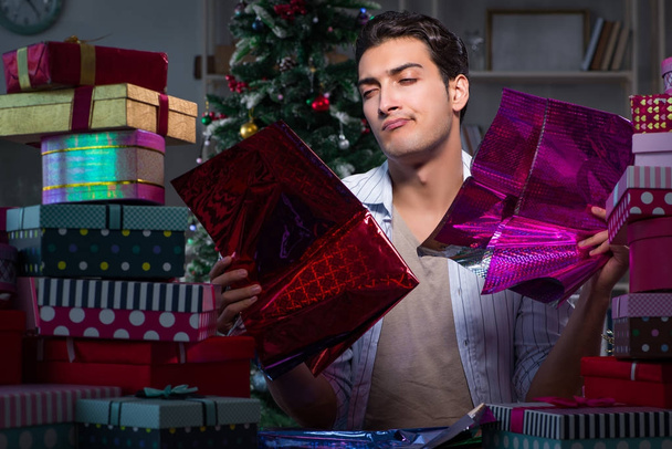 Man with many christmas gifts in boxes - Foto, Bild