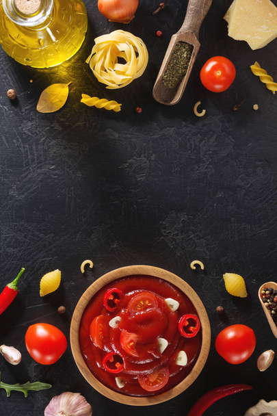 tomato sauce in bowl on black background - Photo, Image