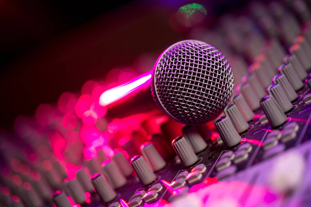 Microphone and Headphones on dirty sound mixer panel - Zdjęcie, obraz