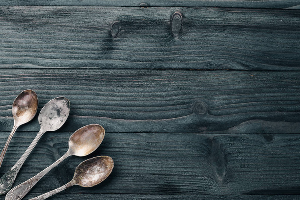 Old cutlery. On a wooden background. Top view. Free space for text. - Foto, immagini
