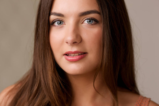 Portrait of beautiful brunette young girl with long hair closeup - Fotografie, Obrázek
